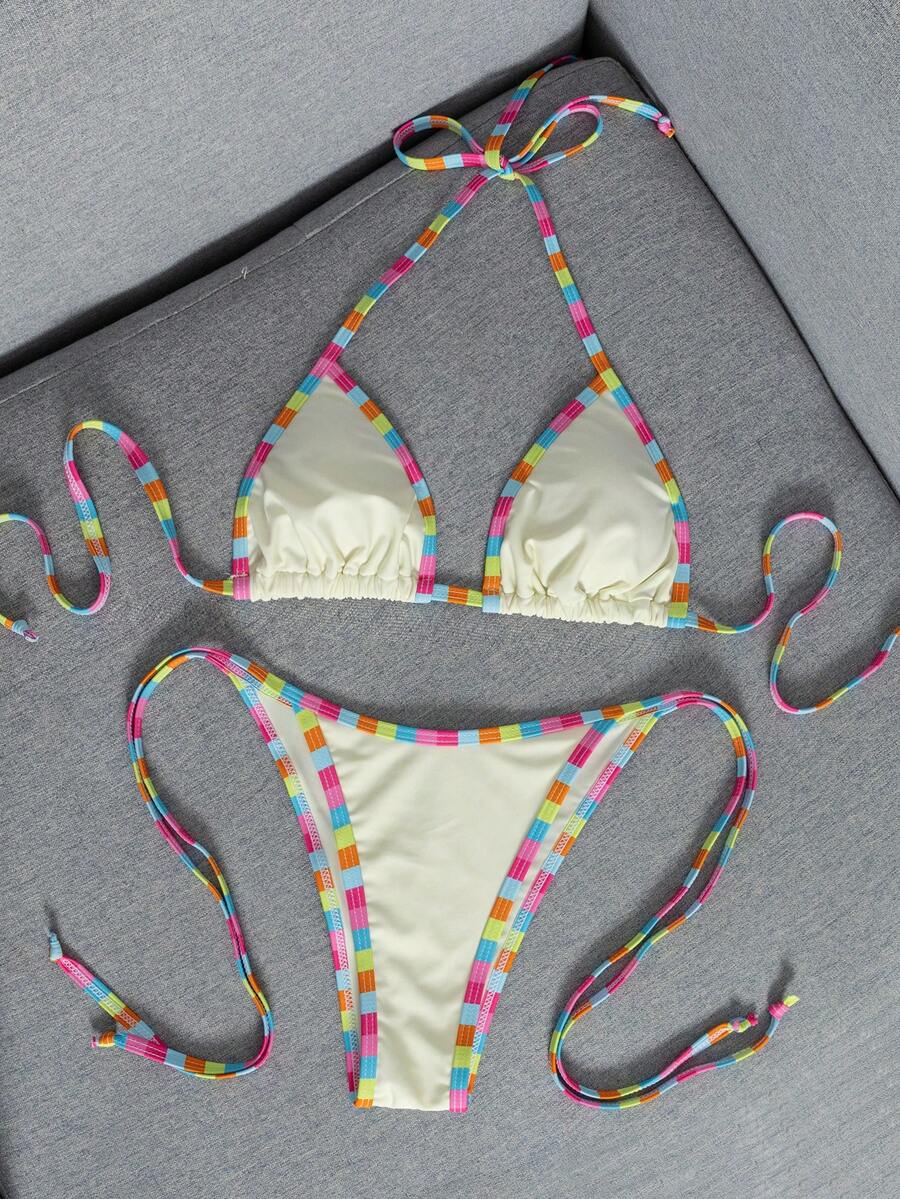 Women's two-piece halter triangle bikini set featuring a backless tie-back top with removable padding and matching tie-side mid-waist bottoms.
