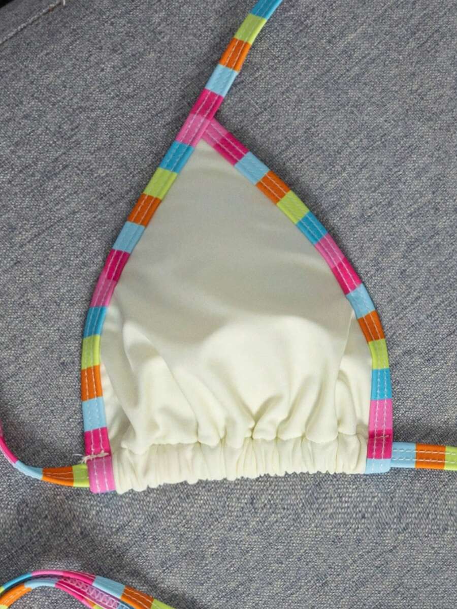 Women's two-piece halter triangle bikini set featuring a backless tie-back top with removable padding and matching tie-side mid-waist bottoms.