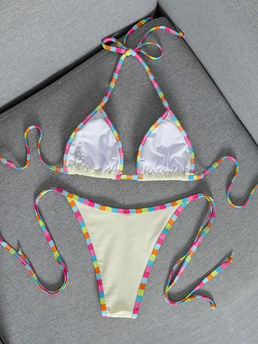 Women's two-piece halter triangle bikini set featuring a backless tie-back top with removable padding and matching tie-side mid-waist bottoms.