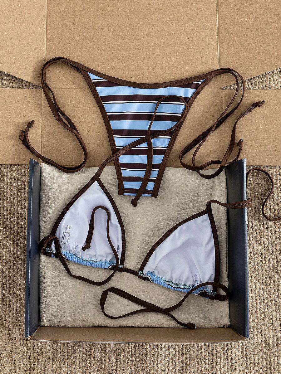 Women's two-piece halter triangle bikini set featuring a backless tie-back top with removable padding and matching tie-side mid-waist bottoms.
