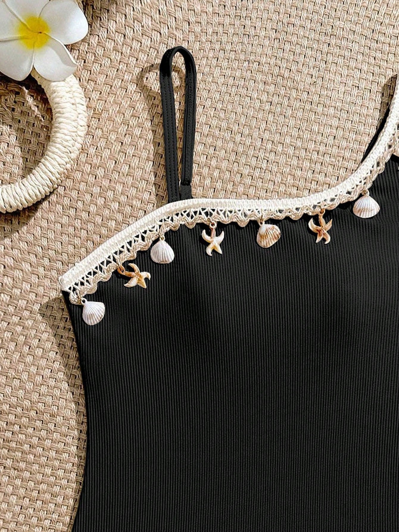 Tween girls one-piece swimsuit featuring an asymmetric neckline, pendant decor, plain design, wireless bra, high-cut bottom, and medium-stretch fabric.