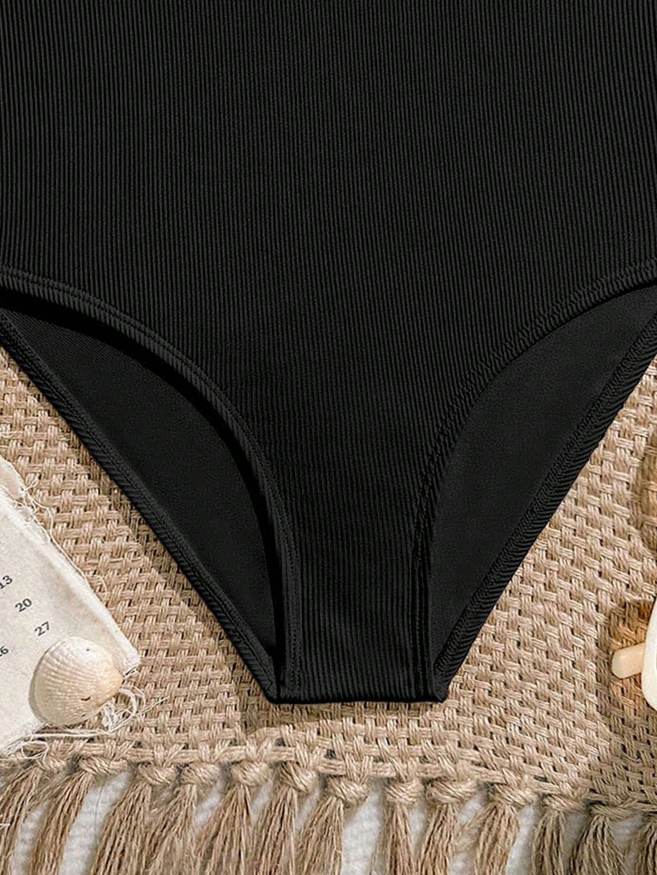 Tween girls one-piece swimsuit featuring an asymmetric neckline, pendant decor, plain design, wireless bra, high-cut bottom, and medium-stretch fabric.