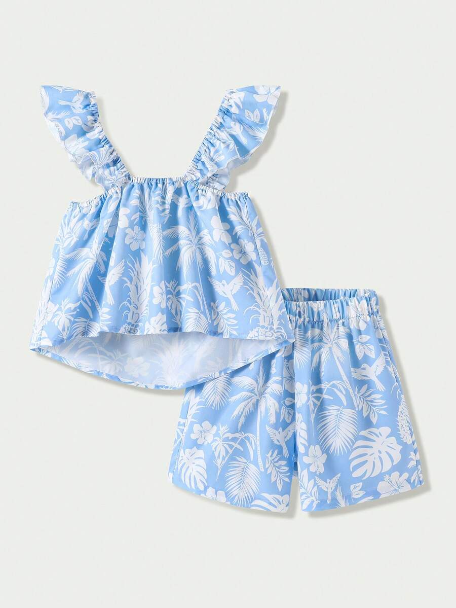 Tween girl wearing a blue and white striped sleeveless top featuring embroidery details and ruffle trim with matching shorts.