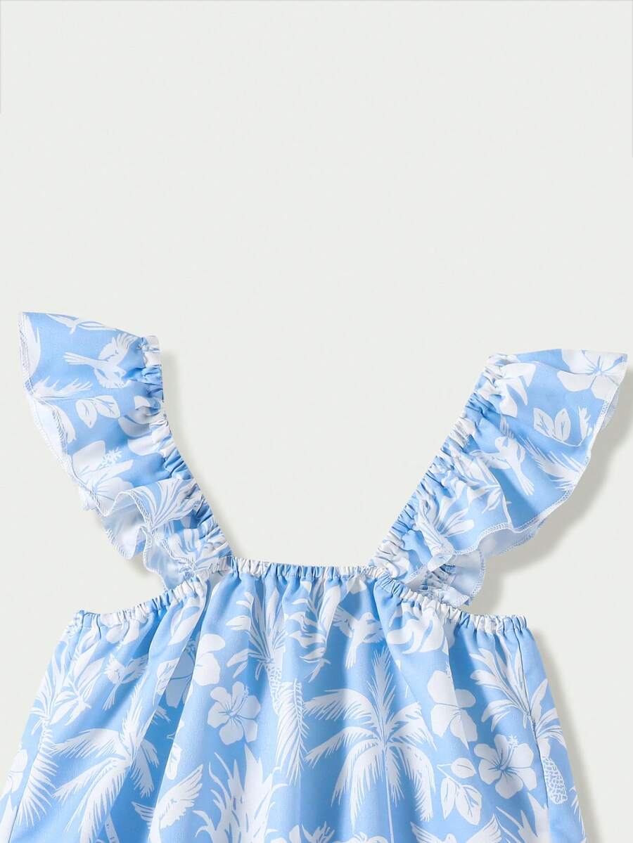 Tween girl wearing a blue and white striped sleeveless top featuring embroidery details and ruffle trim with matching shorts.