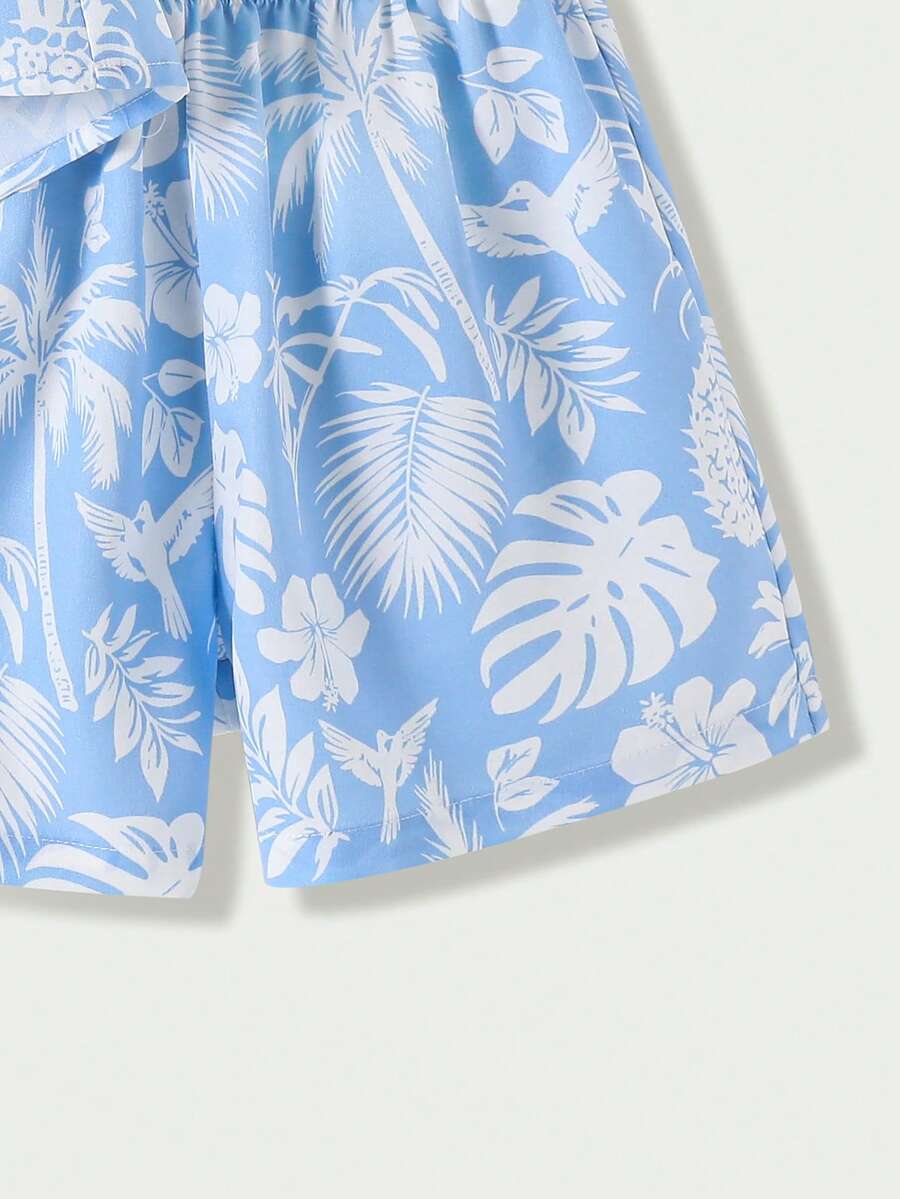 Tween girl wearing a blue and white striped sleeveless top featuring embroidery details and ruffle trim with matching shorts.