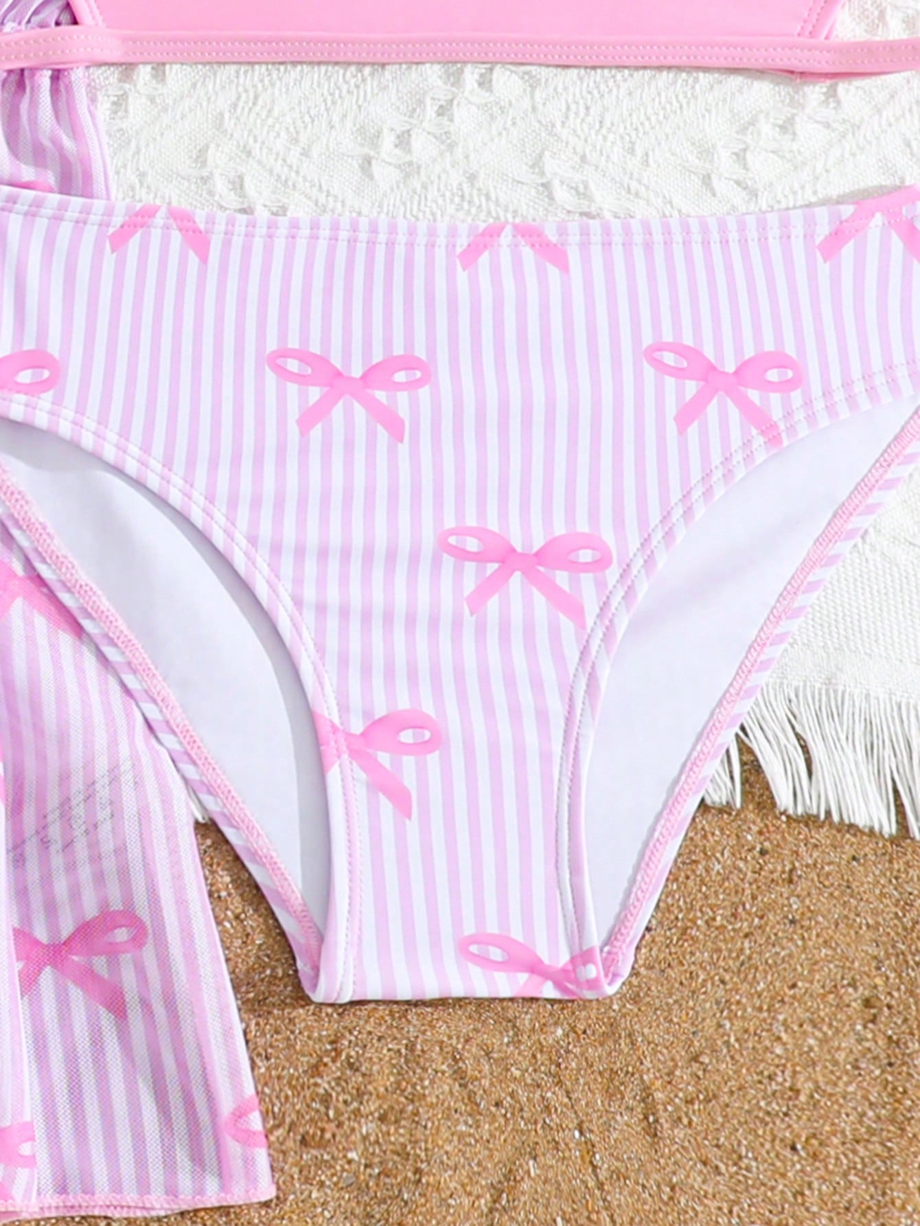 Tween girls 3-piece striped swimwear set featuring a tankini top, mid-waist bikini bottoms with a drawstring waist, and a matching kimono cover-up for beach or vacation wear.