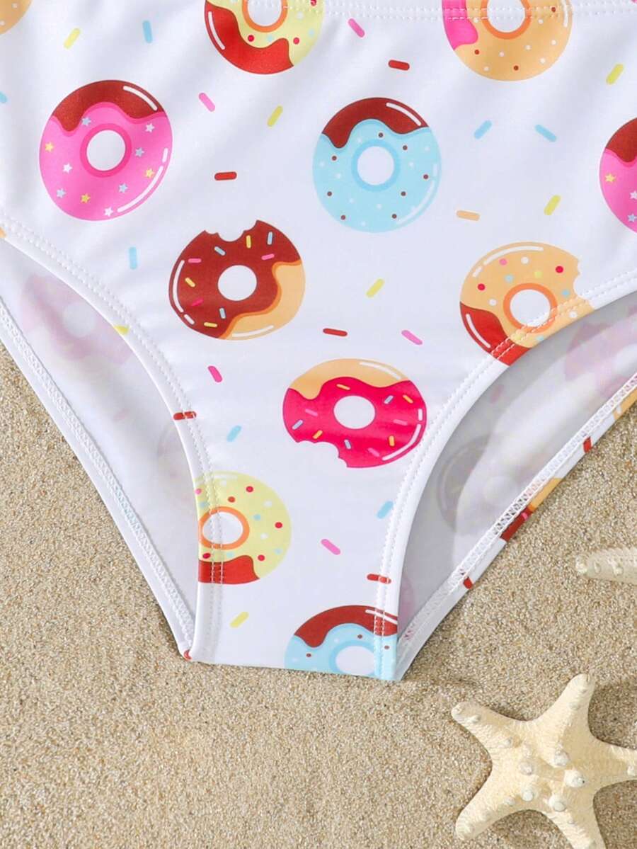 Tween girls multicolor striped 2-piece bikini set with spaghetti strap top, twist detail, and short high-waist or mid-waist swim bottoms for beach and pool wear.
