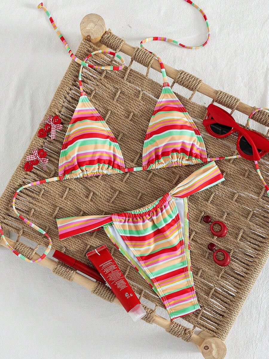 Women's striped halter two-piece swimsuit featuring a lace-up triangle top with removable padding and high-cut low-waist bikini bottoms.