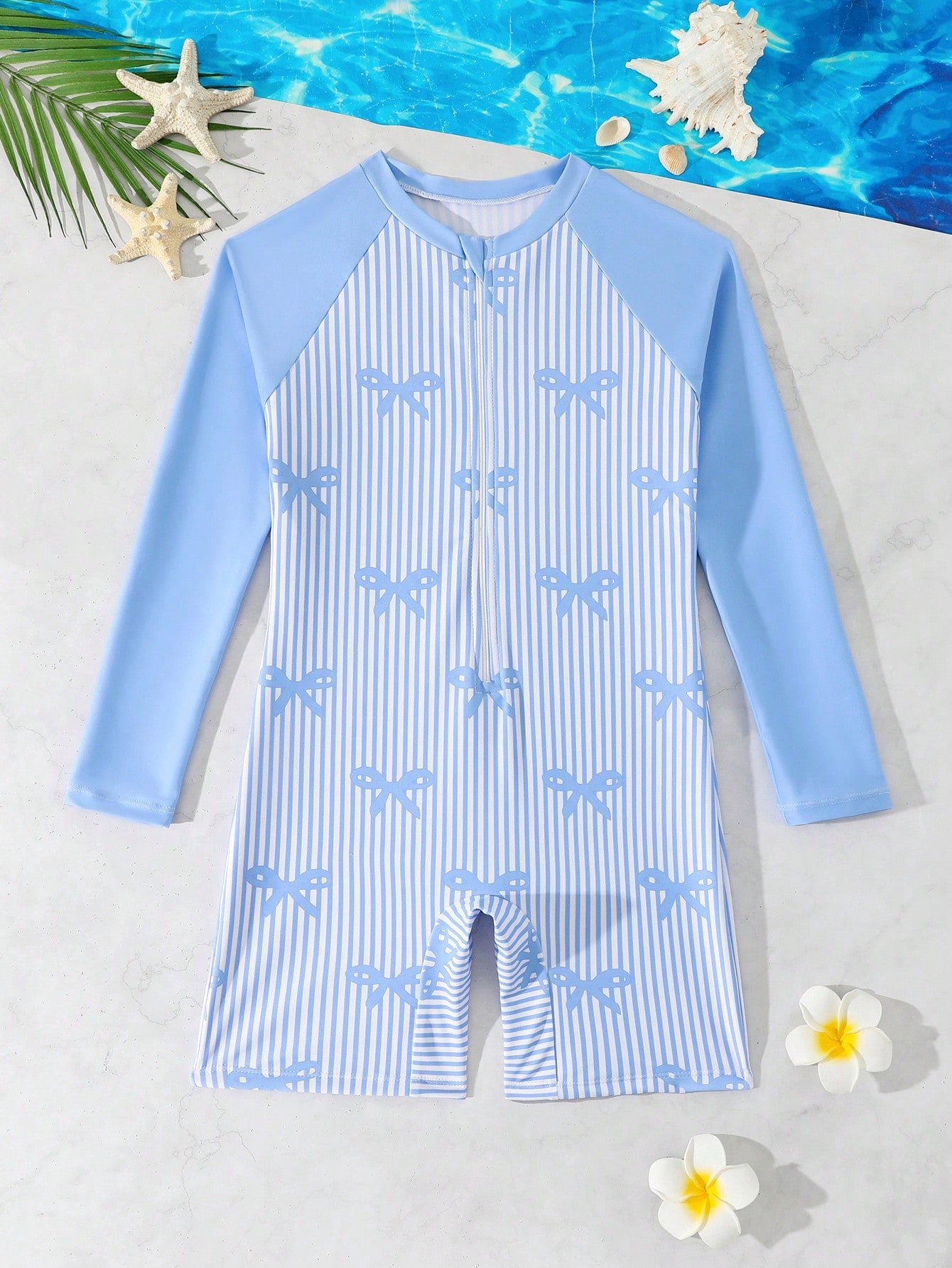 Tween girls one-piece swimsuit featuring a high neck, long sleeves, and shorts bottom, with a back zipper and strawberry plaid digital print on stretch knit fabric. Designed for swimming, vacation, and summer wear.