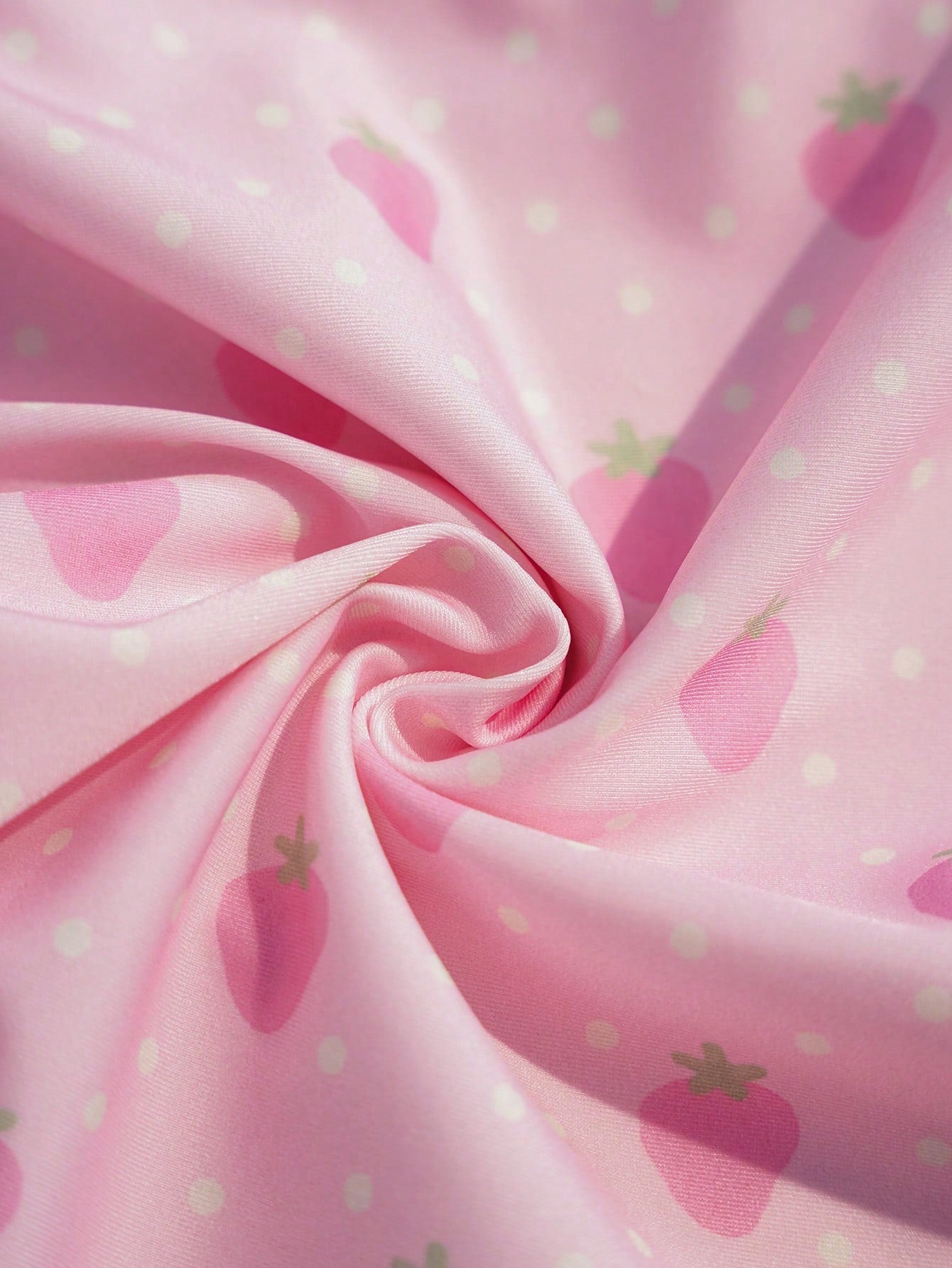 Pink tween girls one-piece swimsuit with ruffle details, spaghetti straps, plant pattern, and matching cover-up skirt set for summer beach wear