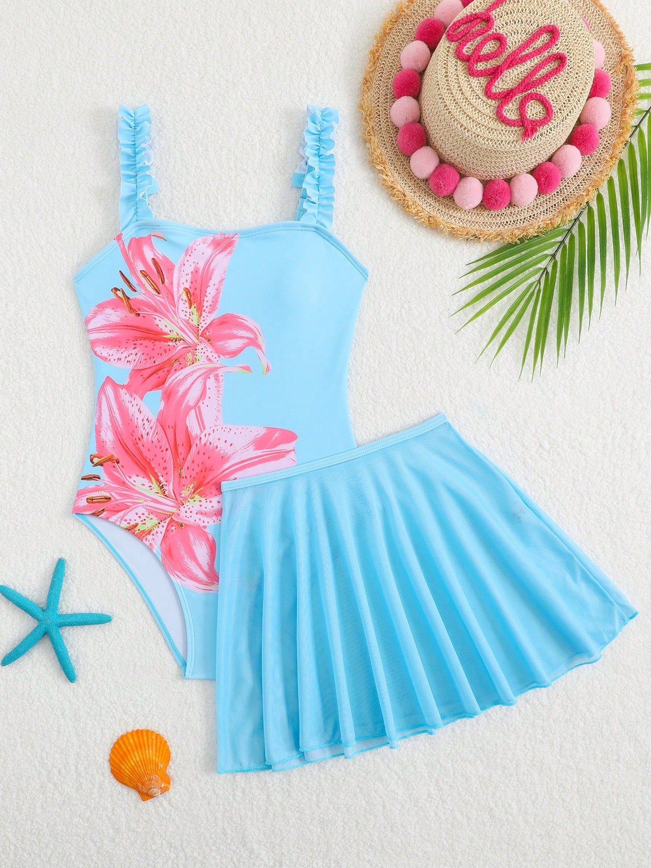 Girls floral print swimsuit set with strap neckline, sleeveless fitted top, and pleated mesh skirt bottom for beach and summer vacation wear.
