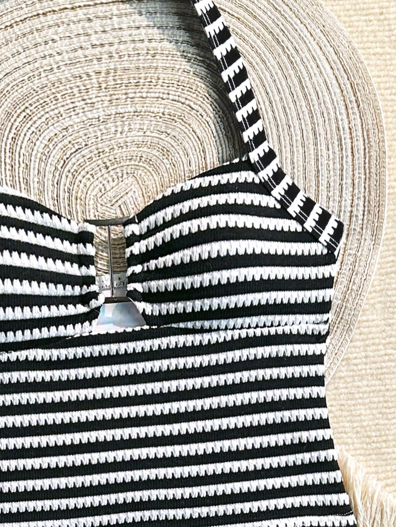 Two-piece tween girls swimwear set in pink with a wavy striped pattern and metallic decor, featuring a halter sleeveless top and mid-waist bottoms in soft, medium-stretch knit fabric, suitable for beach or pool wear.