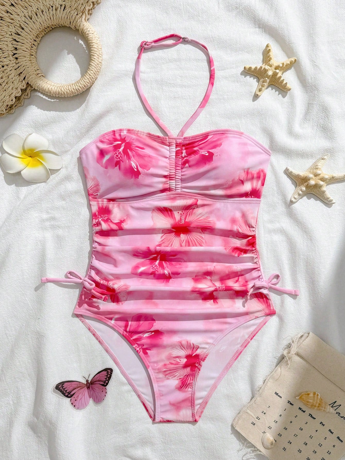Blue halter one-piece swimsuit for tween girls with full geometric print, wireless bra design, mid-waist bottom, and medium-stretch fabric for beach and pool wear.