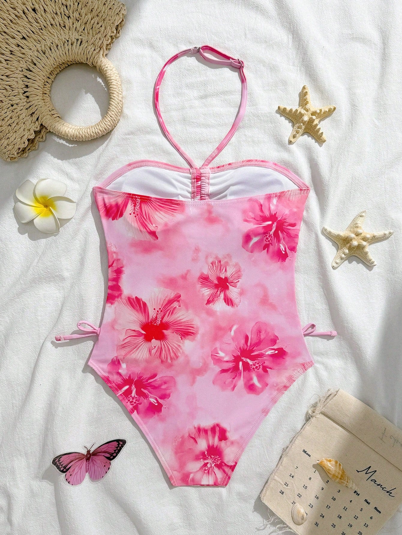 Blue halter one-piece swimsuit for tween girls with full geometric print, wireless bra design, mid-waist bottom, and medium-stretch fabric for beach and pool wear.
