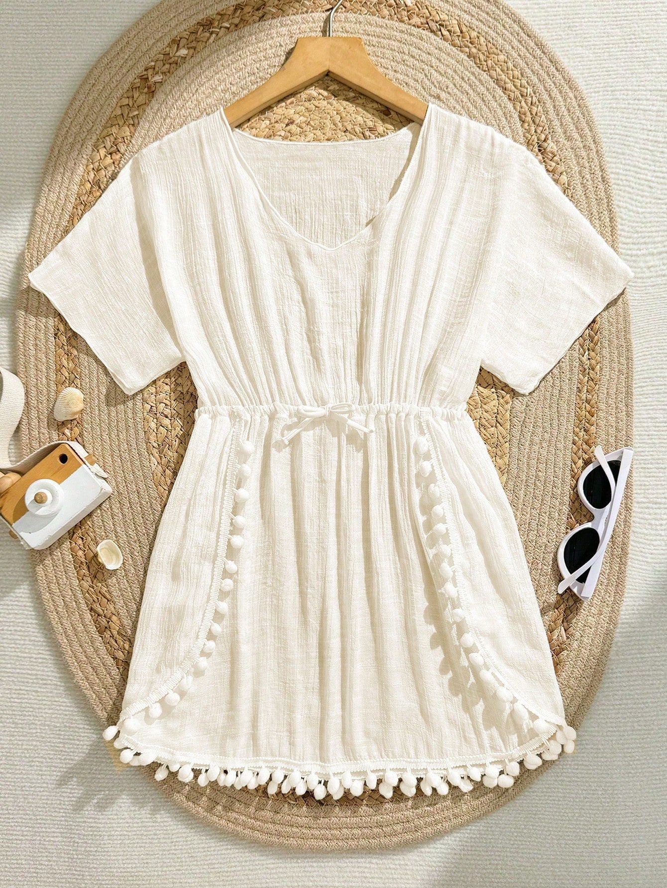 White tween girls swimsuit cover-up with V neck, short sleeves, contrast lace, fringe details, and regular length mesh fabric for beachwear