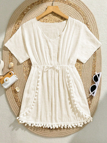 White tween girls swimsuit cover-up with V neck, short sleeves, contrast lace, fringe details, and regular length mesh fabric for beachwear
