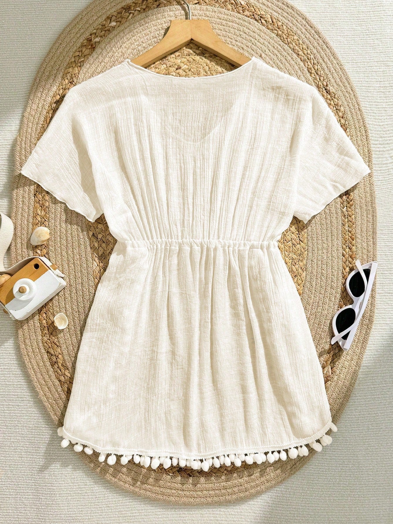 White tween girls swimsuit cover-up with V neck, short sleeves, contrast lace, fringe details, and regular length mesh fabric for beachwear