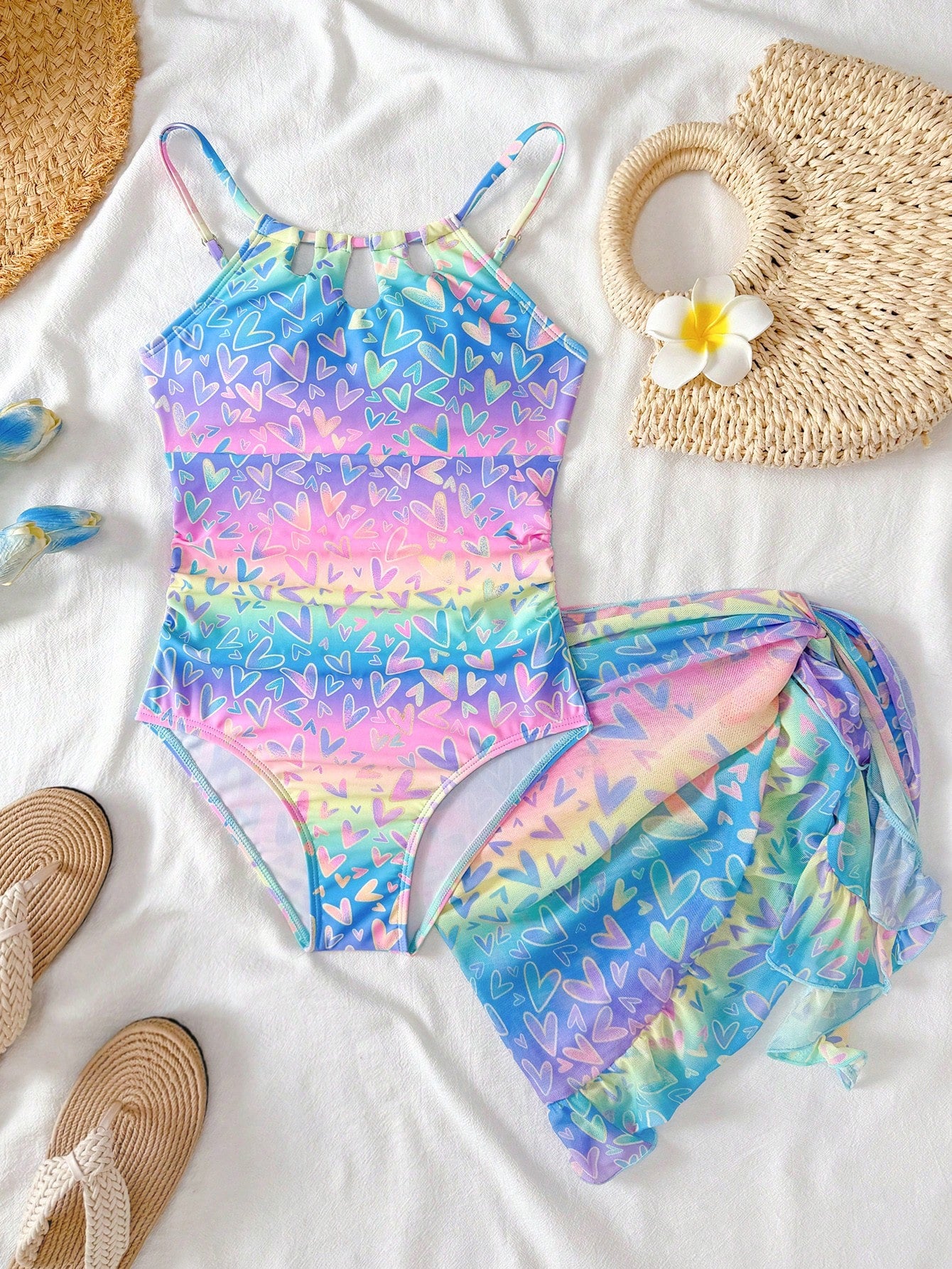 Girls black and white one-piece swimsuit set with cut-out detail, spaghetti straps, sleeveless fitted design, and matching skirt bottom for vacation swimwear.