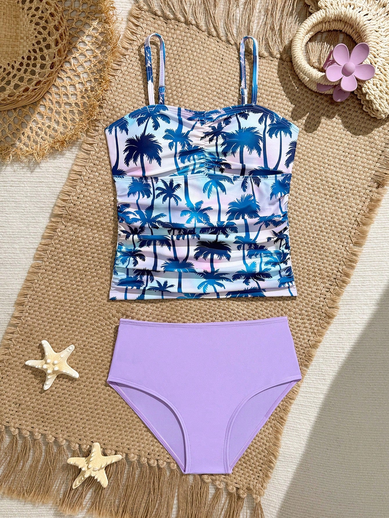 Tween girls 2-piece bikini swimwear set in black with a wave-pattern geometric design, featuring halter neckline, wireless top, and high-waist short bottoms with starfish and shell decor.