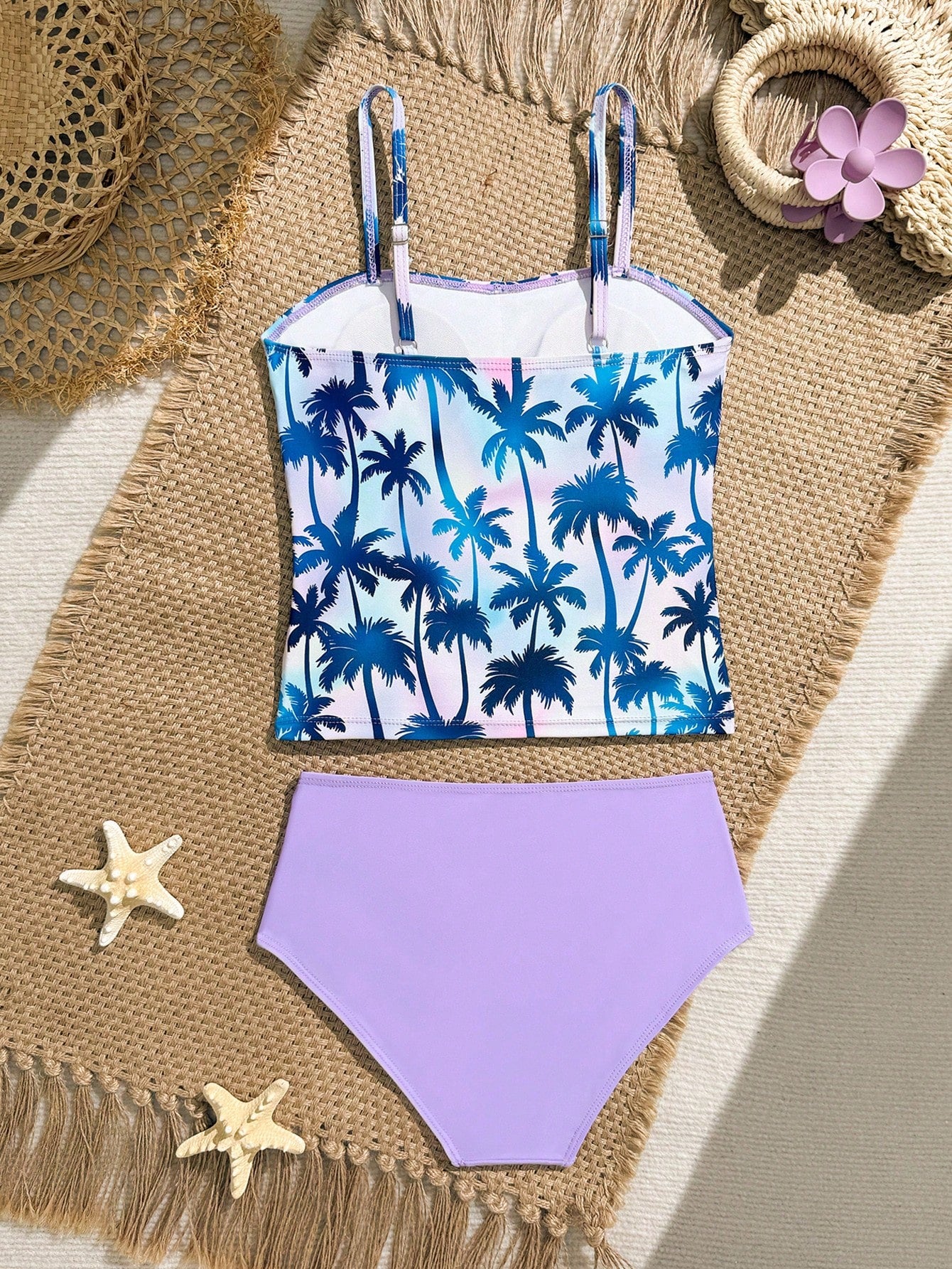 Tween girls 2-piece bikini swimwear set in black with a wave-pattern geometric design, featuring halter neckline, wireless top, and high-waist short bottoms with starfish and shell decor.