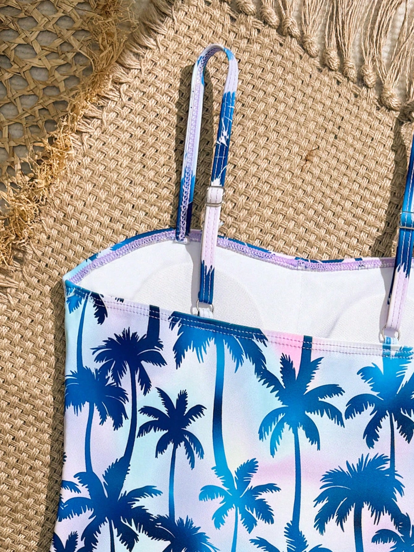 Tween girls 2-piece bikini swimwear set in black with a wave-pattern geometric design, featuring halter neckline, wireless top, and high-waist short bottoms with starfish and shell decor.