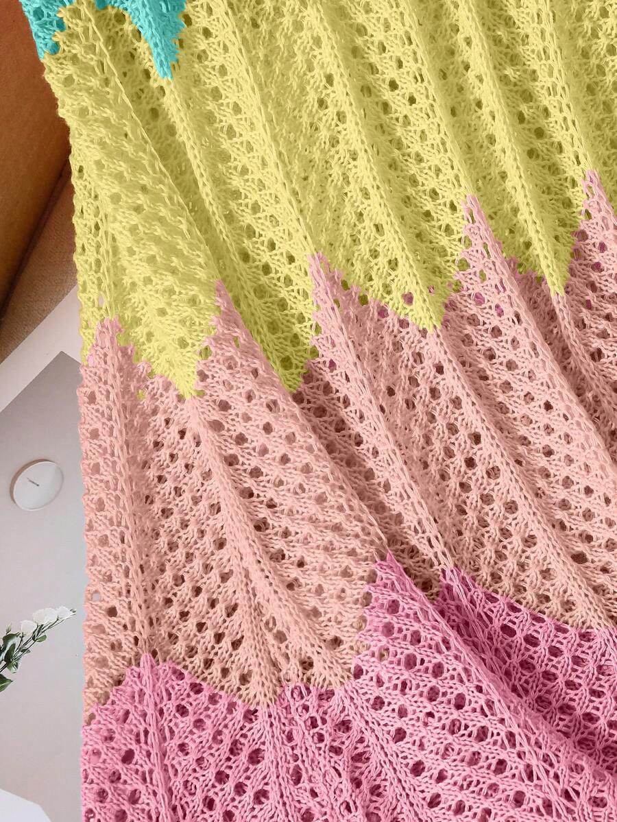 Girls' multicolor rainbow gradient crochet beach cover up with hollow-out knit design, spaghetti straps, sleeveless A-line shape, and semi-sheer finish.