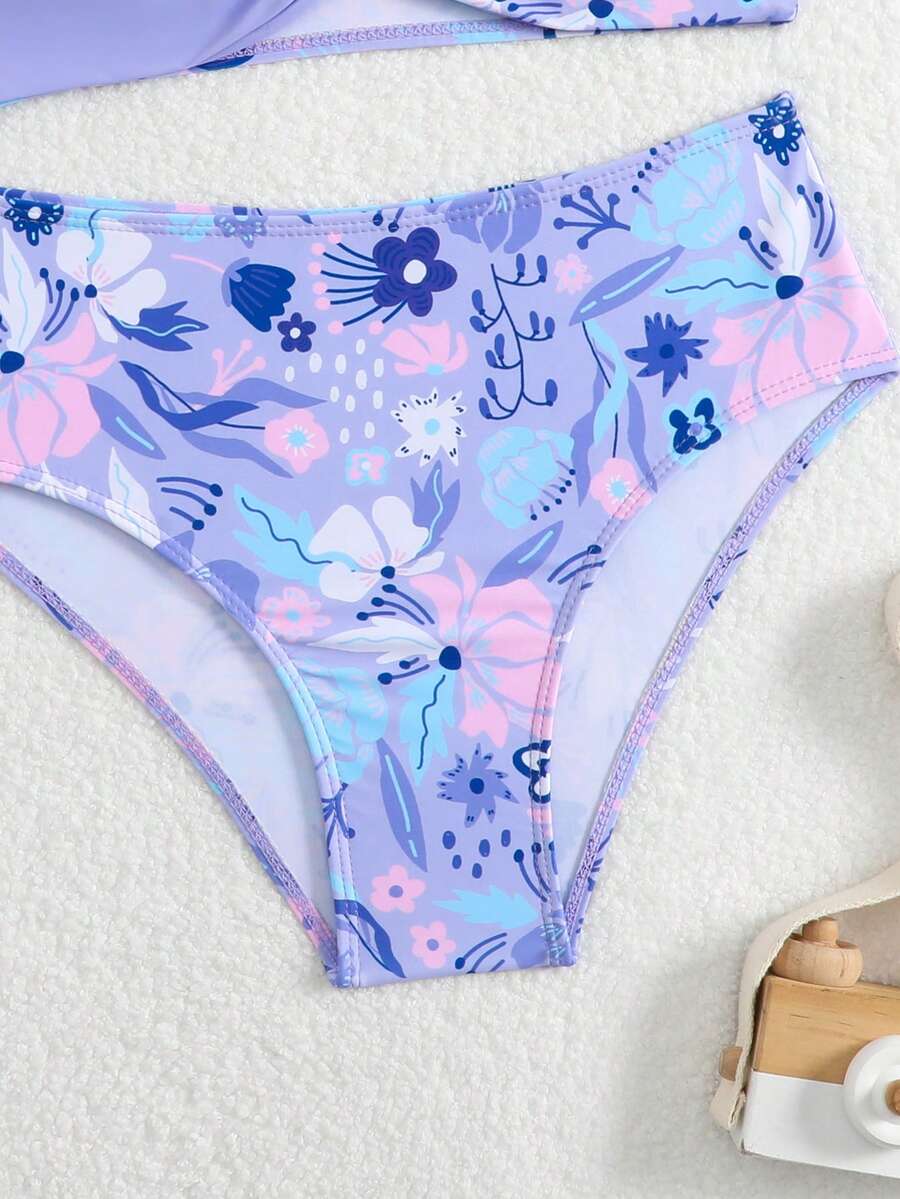 Tween girls multicolor striped 2-piece bikini set with spaghetti strap top, twist detail, and short high-waist or mid-waist swim bottoms for beach and pool wear.