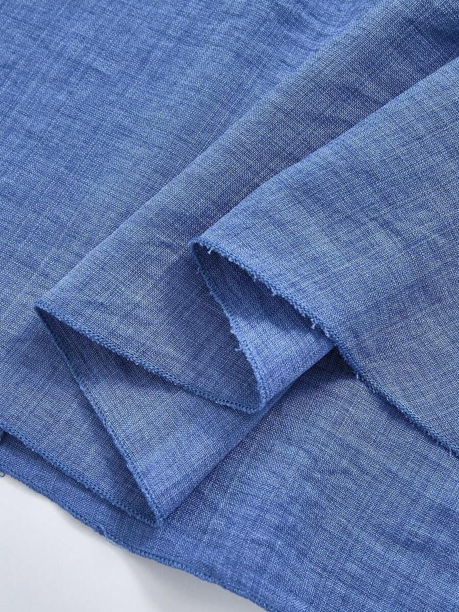 Tween girls dusty blue casual A-line dress with round neck, ruffle accents, high waist, and flared hem.