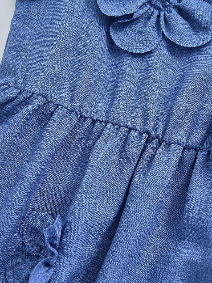 Tween girls dusty blue casual A-line dress with round neck, ruffle accents, high waist, and flared hem.