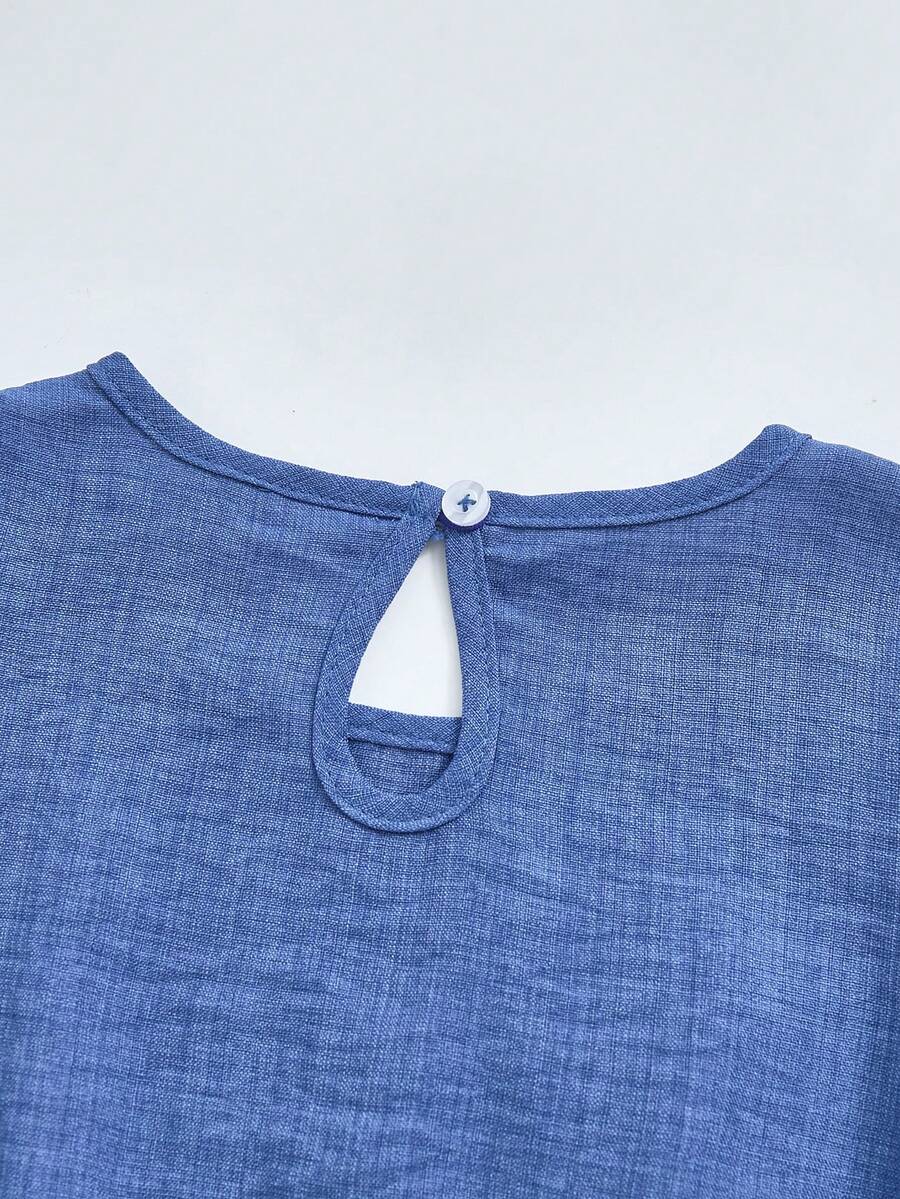 Tween girls dusty blue casual A-line dress with round neck, ruffle accents, high waist, and flared hem.