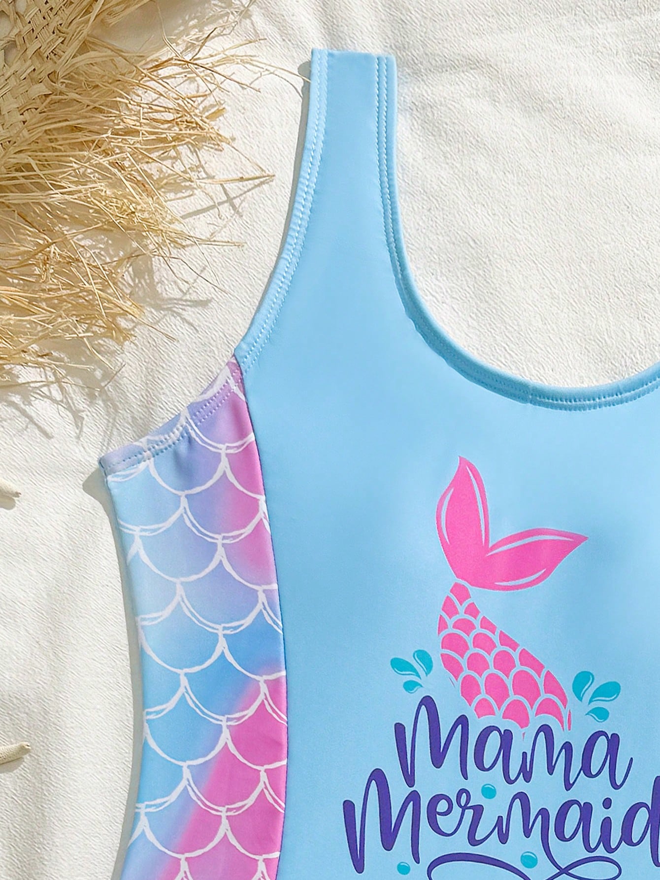 Tween girls 2-piece swimsuit set in black with full floral and plant print, featuring a sleeveless scoop-neck swim top and matching shorts-style bottoms.