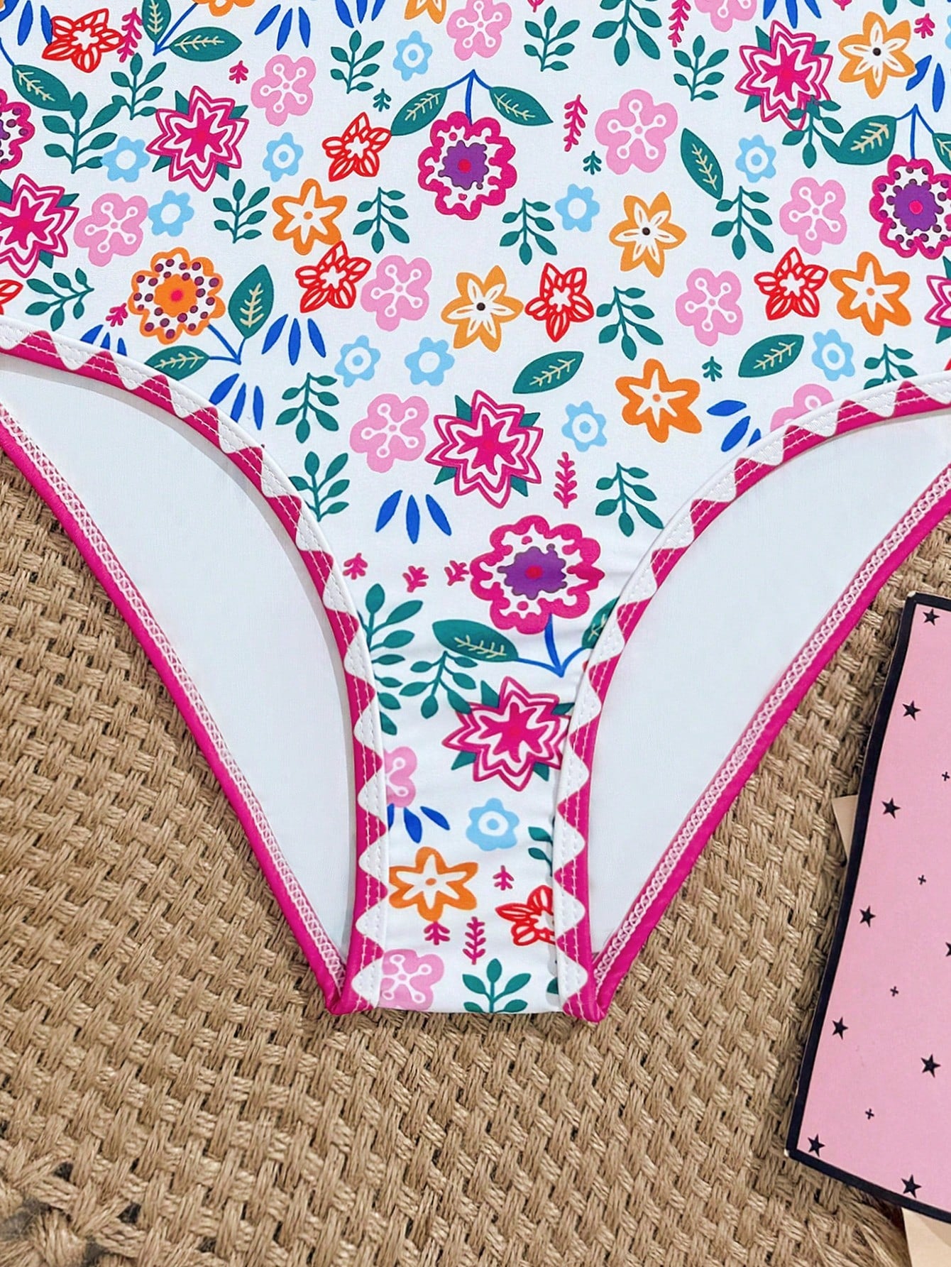 Tween girl one-piece swimsuit with floral plant print, asymmetrical neckline, cut-out detail, and fitted high-stretch design for beach and pool wear