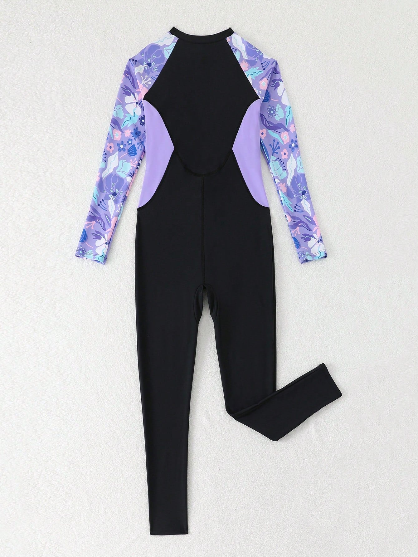 Tween girls black one-piece swimsuit with long sleeves, high neck, zipper detail, graphic leopard heart print, and fitted full-coverage swimwear style.
