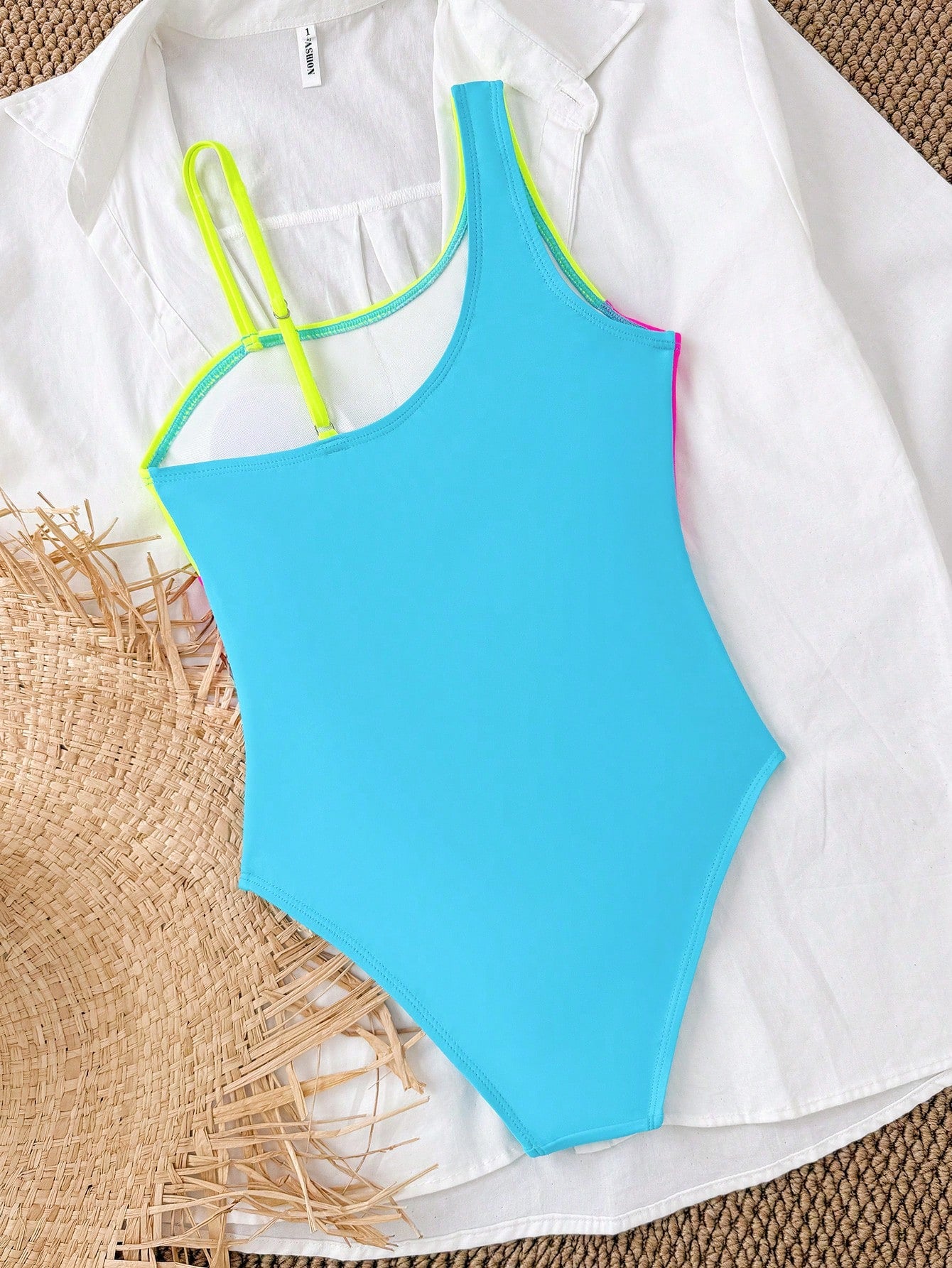 Black one-piece swimsuit for tween girls with cut out detail, spaghetti straps, high waist bottom, wireless bra, and fitted vacation swimwear style.