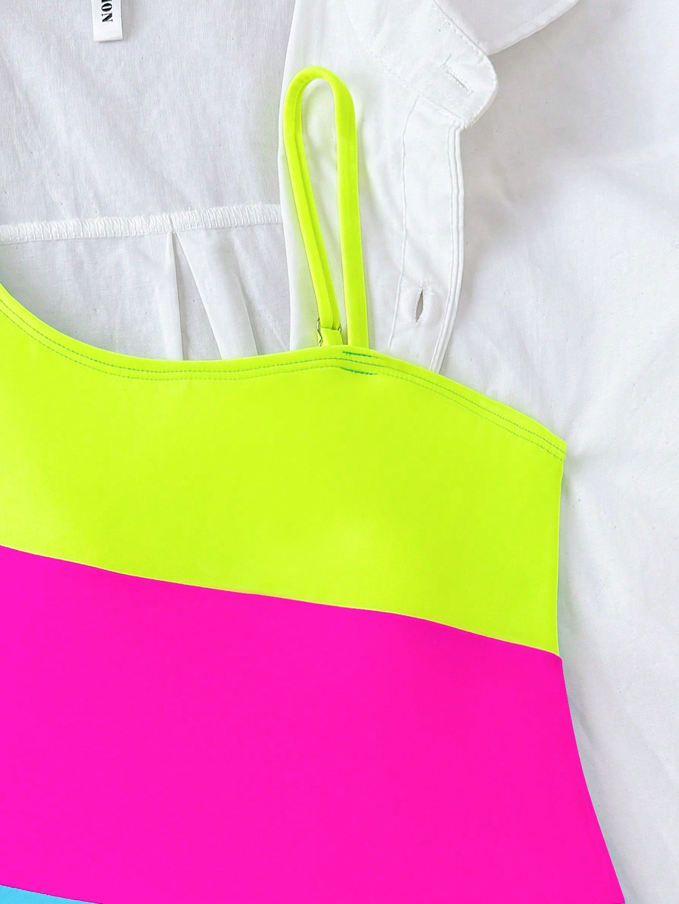 Black one-piece swimsuit for tween girls with cut out detail, spaghetti straps, high waist bottom, wireless bra, and fitted vacation swimwear style.
