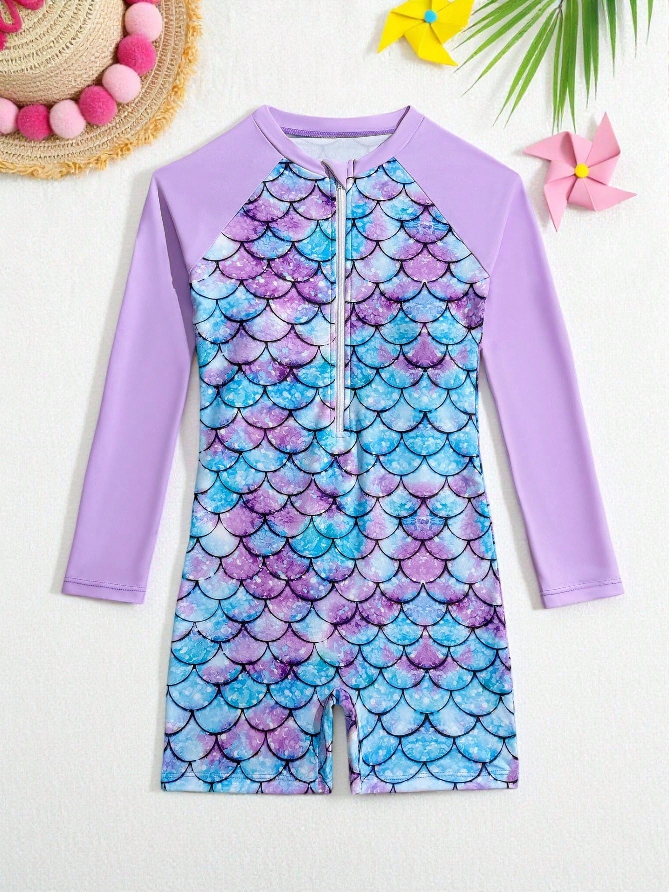 Tween girls one-piece swimsuit featuring a high neck, long sleeves, and shorts bottom, with a back zipper and strawberry plaid digital print on stretch knit fabric. Designed for swimming, vacation, and summer wear.
