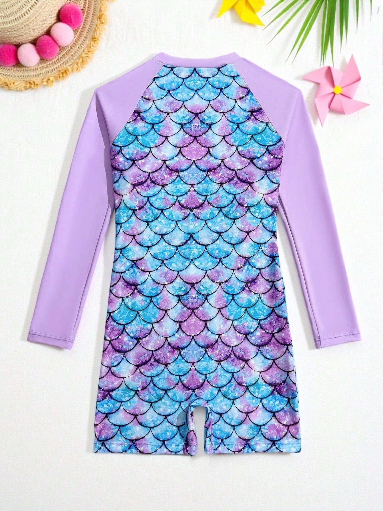 Tween girls one-piece swimsuit featuring a high neck, long sleeves, and shorts bottom, with a back zipper and strawberry plaid digital print on stretch knit fabric. Designed for swimming, vacation, and summer wear.