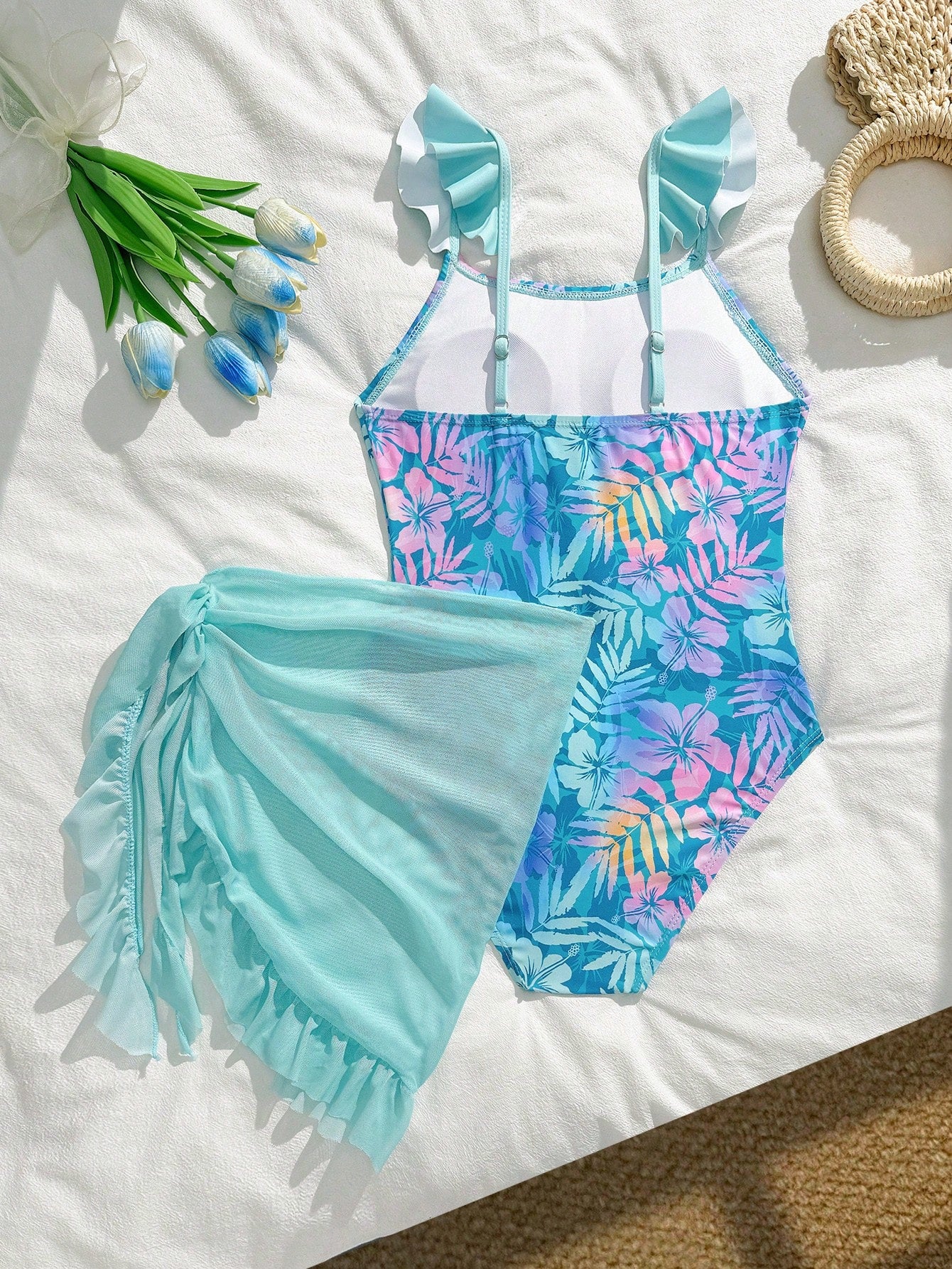 Tween girls one-piece swimsuit in leopard print with ruffle shoulder straps, scoop neckline, fitted shape, and attached ruffle hem skirt; sleeveless, mid-waist skirt bottom, and lined body for swimming, vacation, and summer beach wear.