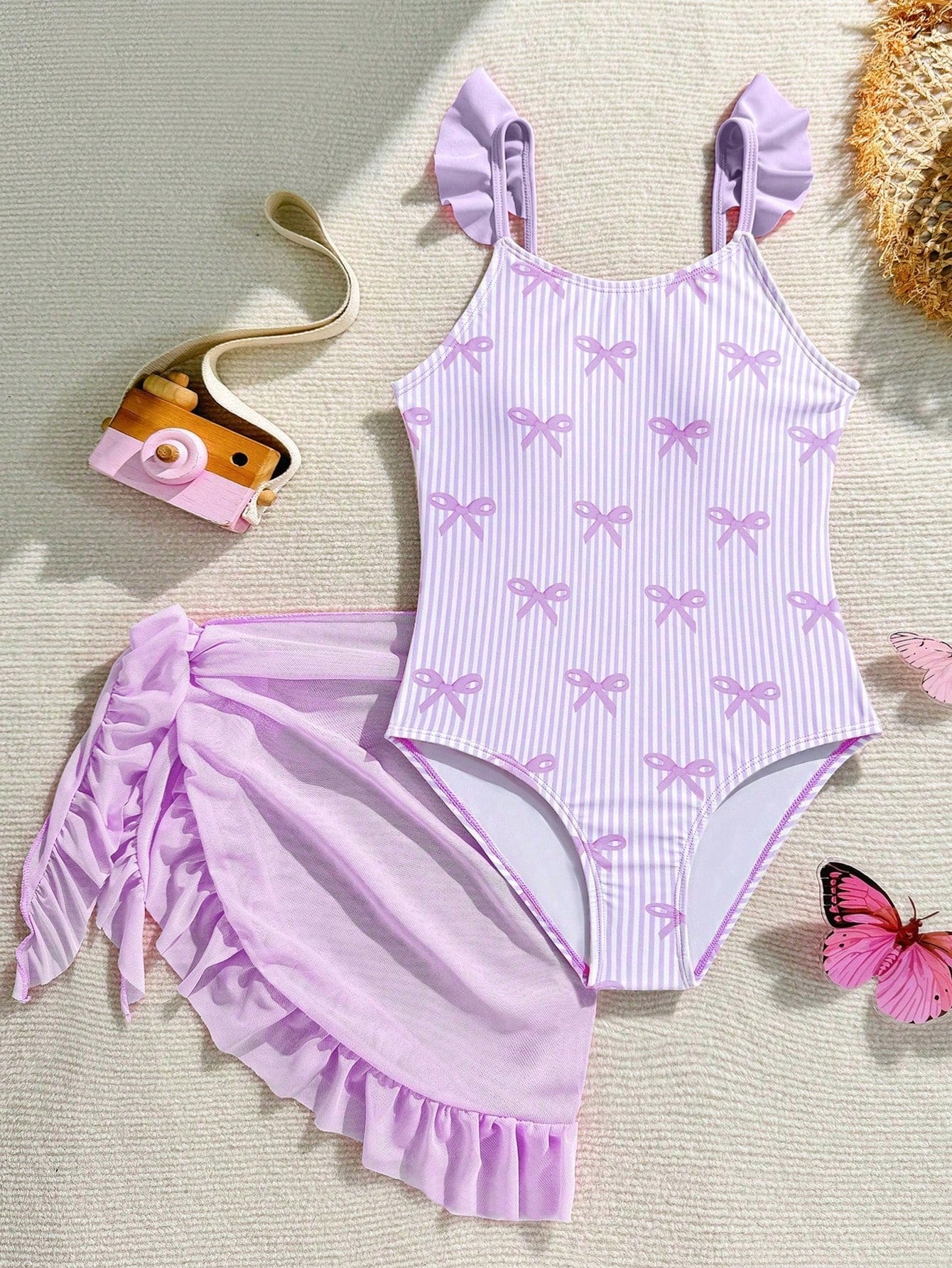 Tween girls one-piece swimsuit in leopard print with ruffle shoulder straps, scoop neckline, fitted shape, and attached ruffle hem skirt; sleeveless, mid-waist skirt bottom, and lined body for swimming, vacation, and summer beach wear.