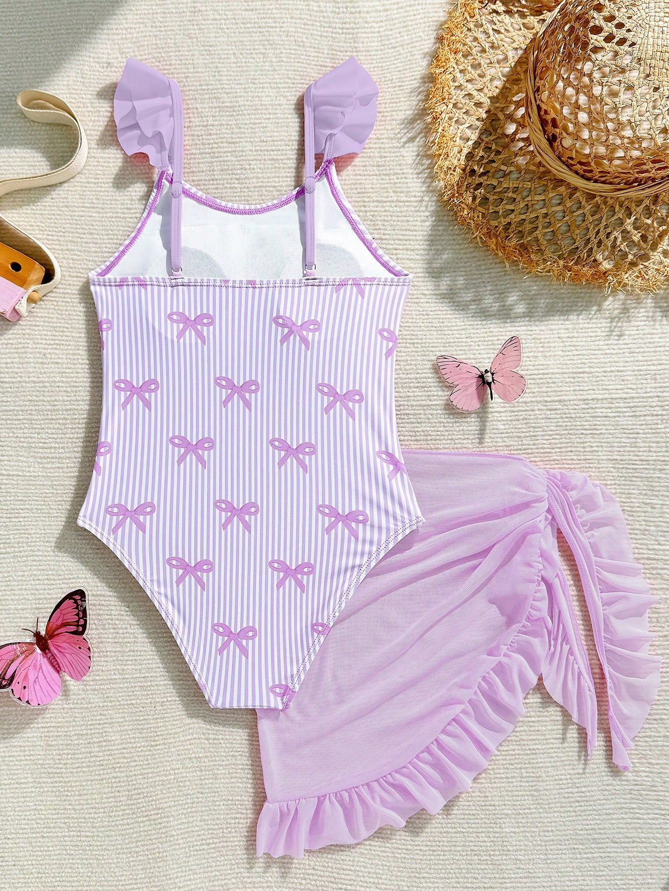 Tween girls one-piece swimsuit in leopard print with ruffle shoulder straps, scoop neckline, fitted shape, and attached ruffle hem skirt; sleeveless, mid-waist skirt bottom, and lined body for swimming, vacation, and summer beach wear.