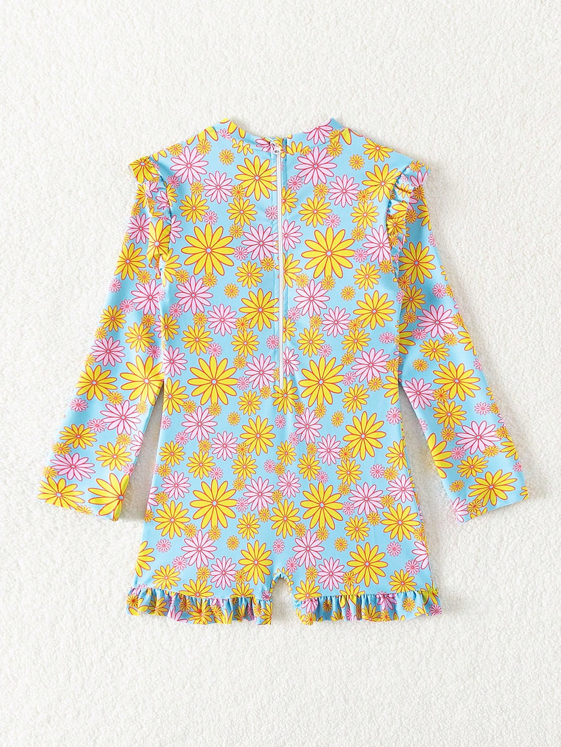 Tween girls' multicolor floral one-piece swimsuit with ruffle trim, high neck, zipper detail, short bottom, and lined high-stretch swim fabric.