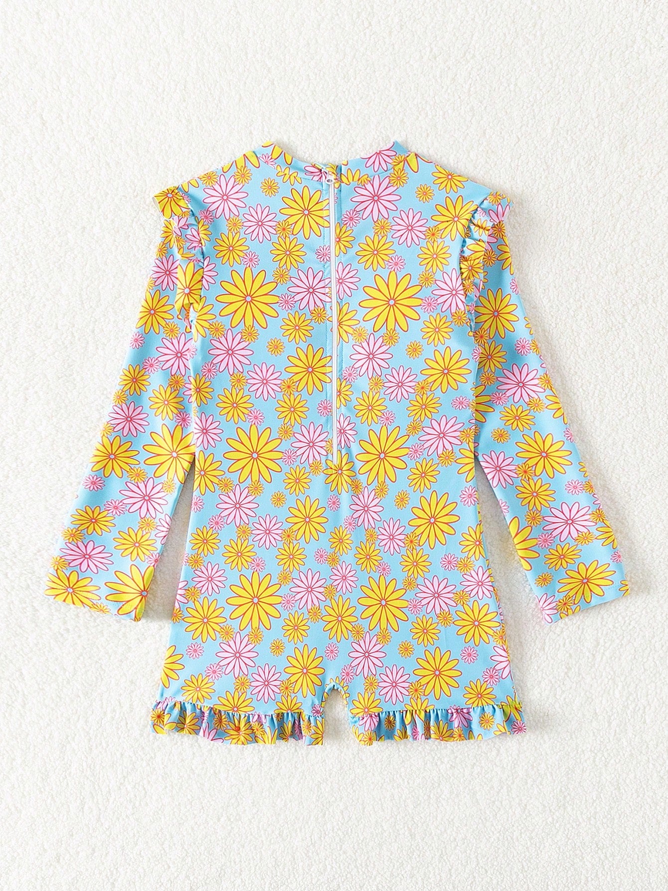 Tween girls' multicolor floral one-piece swimsuit with ruffle trim, high neck, zipper detail, short bottom, and lined high-stretch swim fabric.