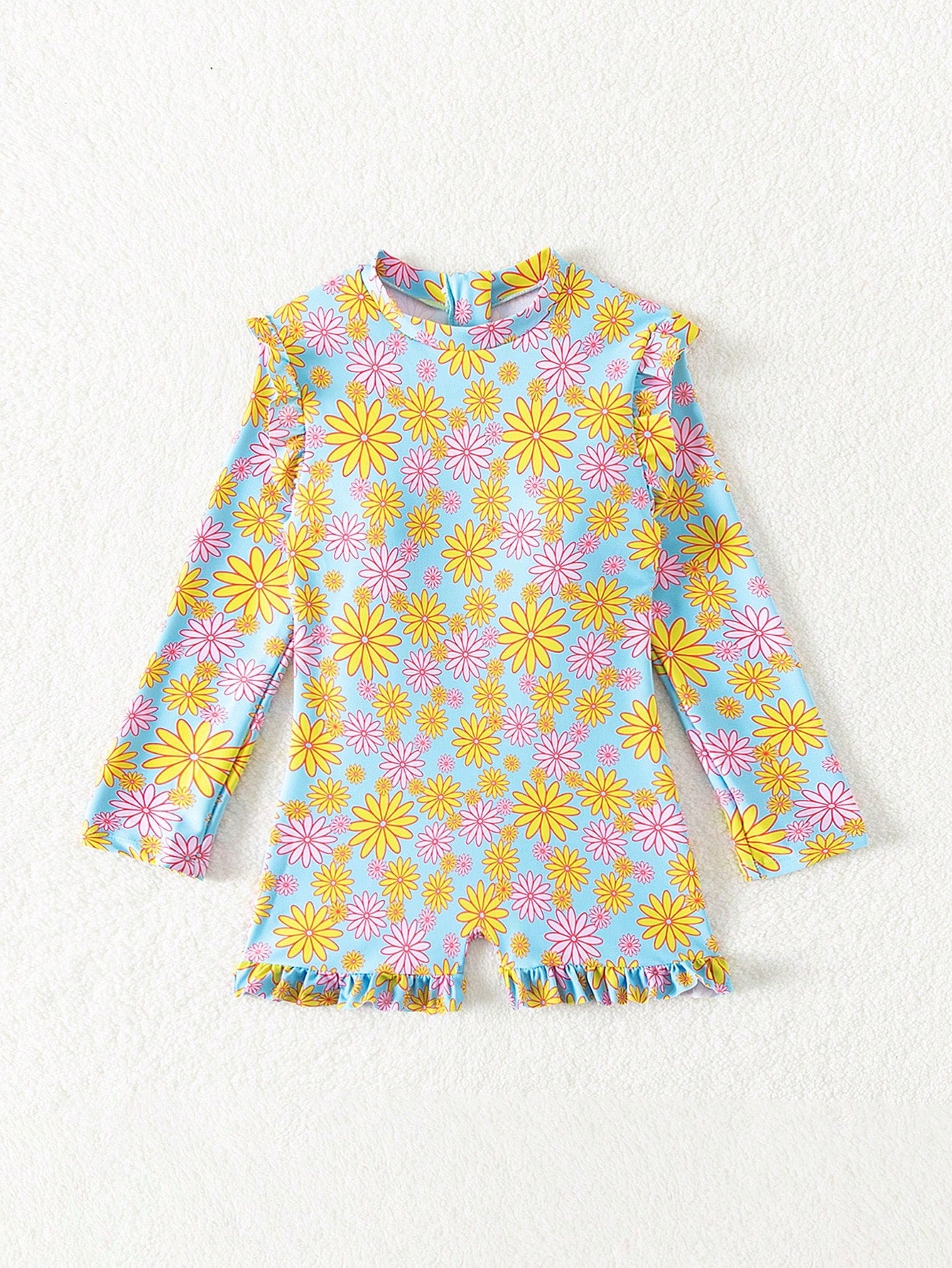 Tween girls' multicolor floral one-piece swimsuit with ruffle trim, high neck, zipper detail, short bottom, and lined high-stretch swim fabric.