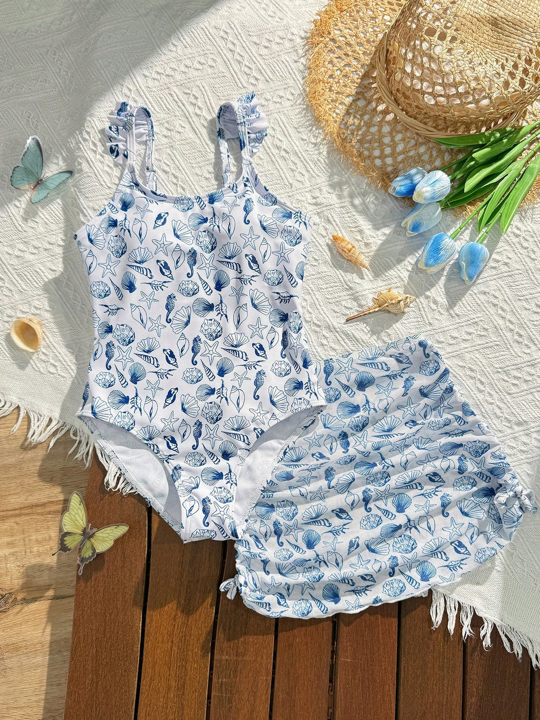 Tween girls multicolor one piece swimsuit set with spaghetti straps, ruffle detail, animal marine life print, and matching mesh cover skirt for summer vacation swimwear.
