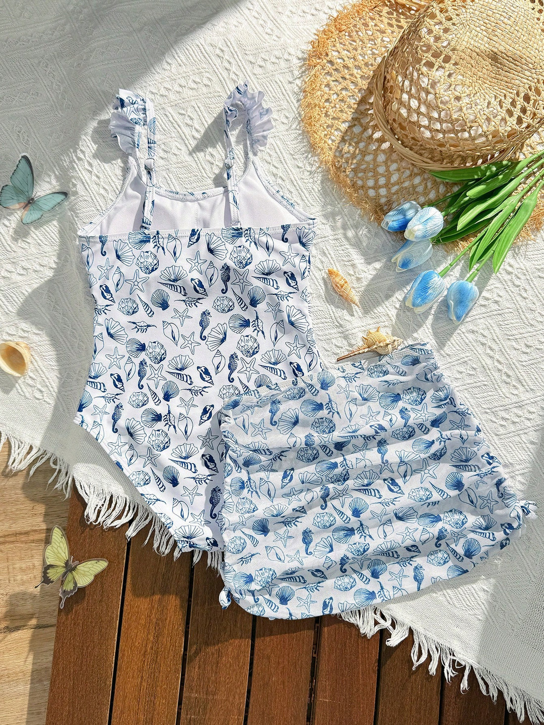 Tween girls multicolor one piece swimsuit set with spaghetti straps, ruffle detail, animal marine life print, and matching mesh cover skirt for summer vacation swimwear.
