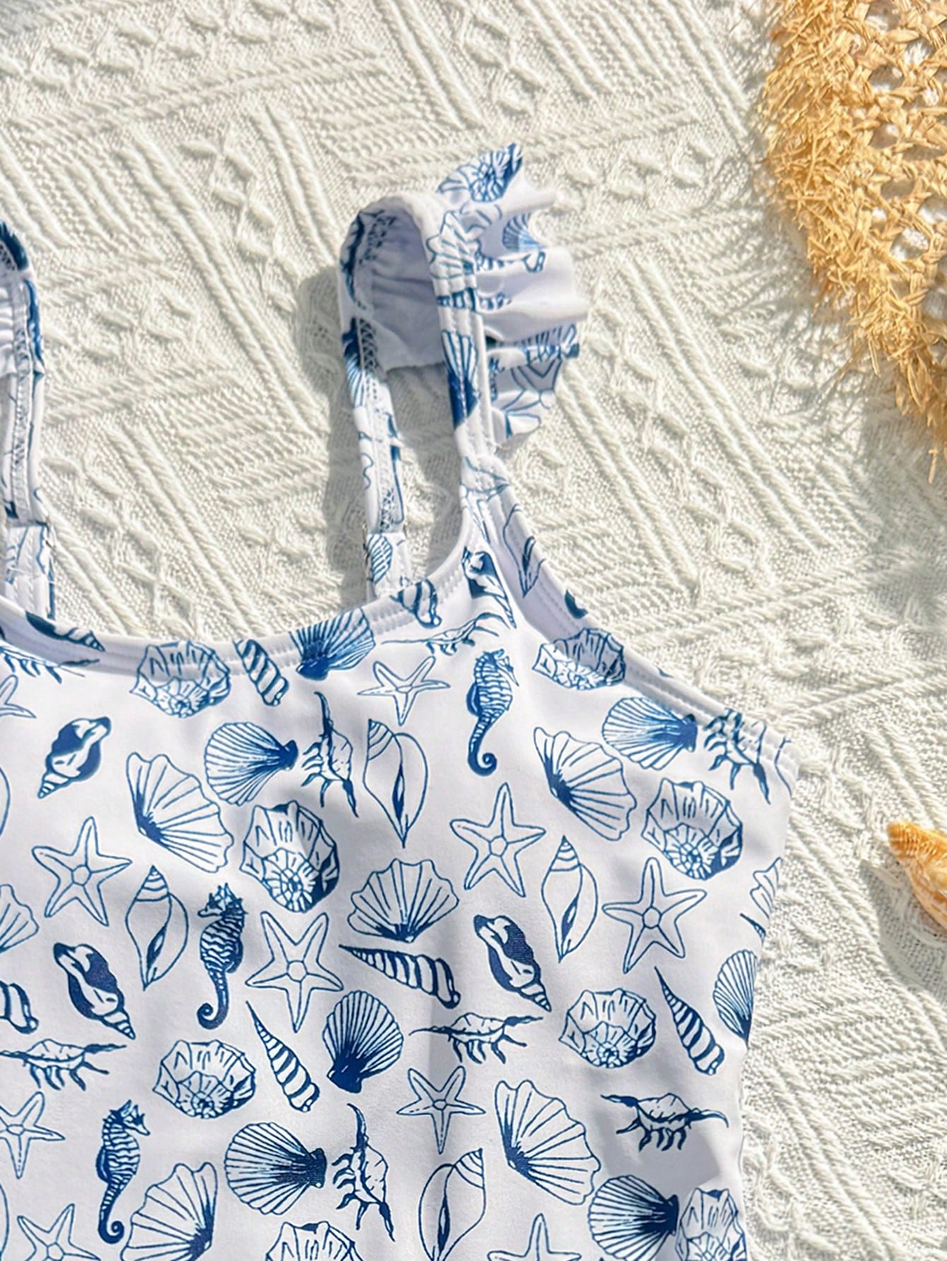 Tween girls multicolor one piece swimsuit set with spaghetti straps, ruffle detail, animal marine life print, and matching mesh cover skirt for summer vacation swimwear.