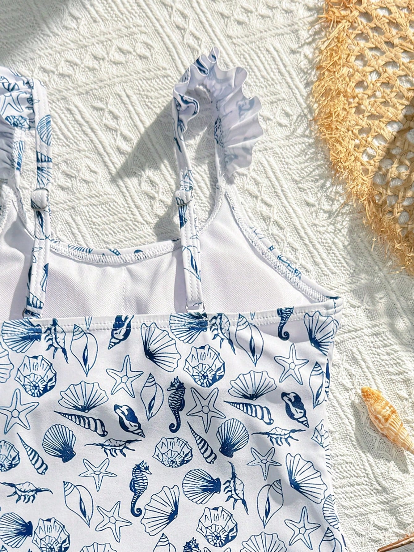Tween girls multicolor one piece swimsuit set with spaghetti straps, ruffle detail, animal marine life print, and matching mesh cover skirt for summer vacation swimwear.