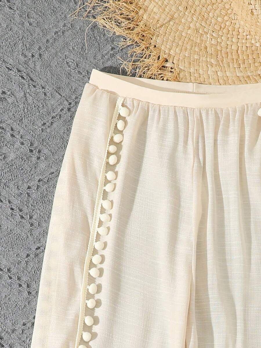 Beige 3-piece swimwear set for tween girls featuring an asymmetrical ruffle top with contrast lace trim, plant pattern, and mid-waist bikini bottoms.