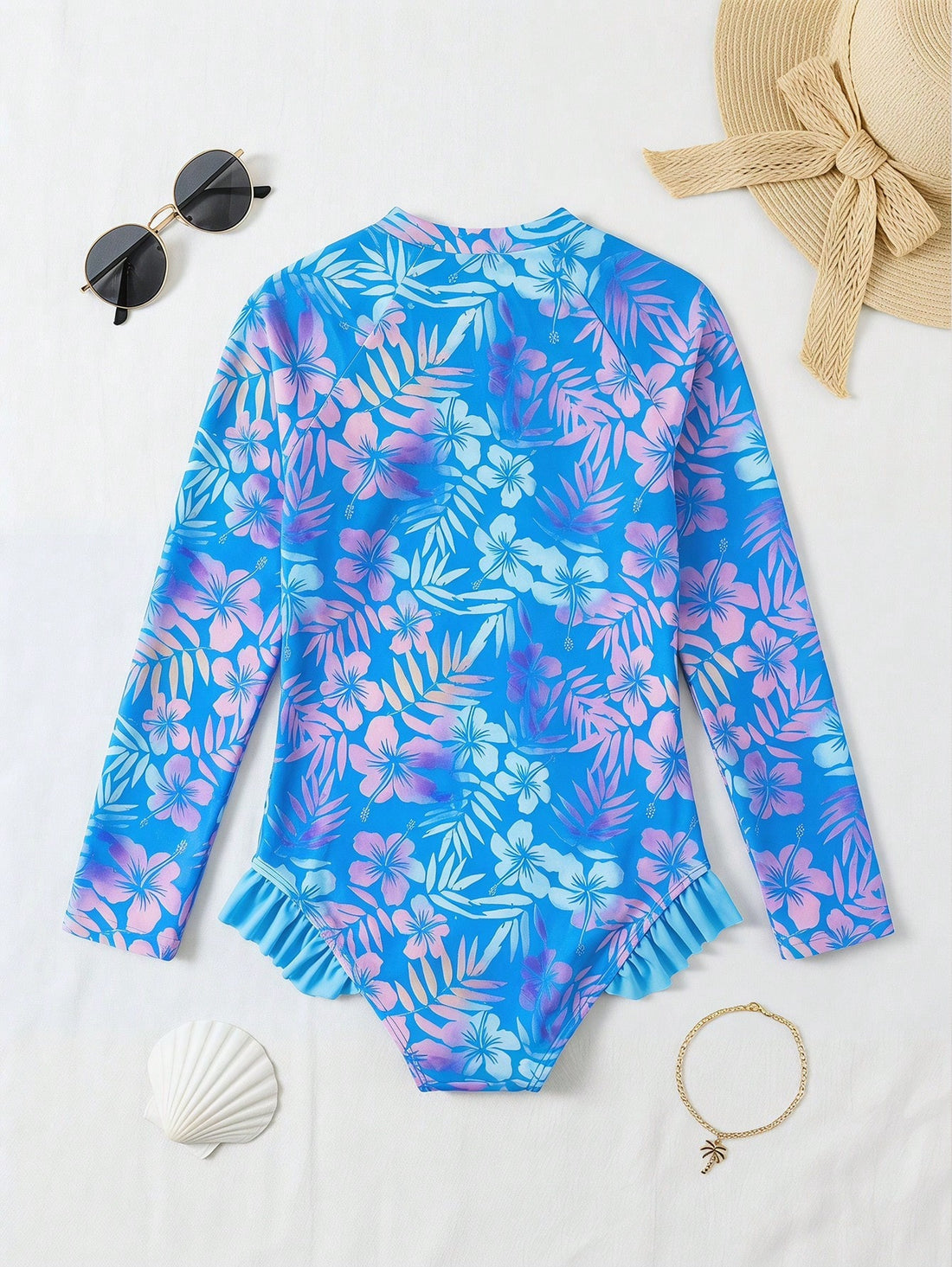 Girls' floral one-piece swimsuit with ruffle trim, high neck, and zipper front for beach and resort wear