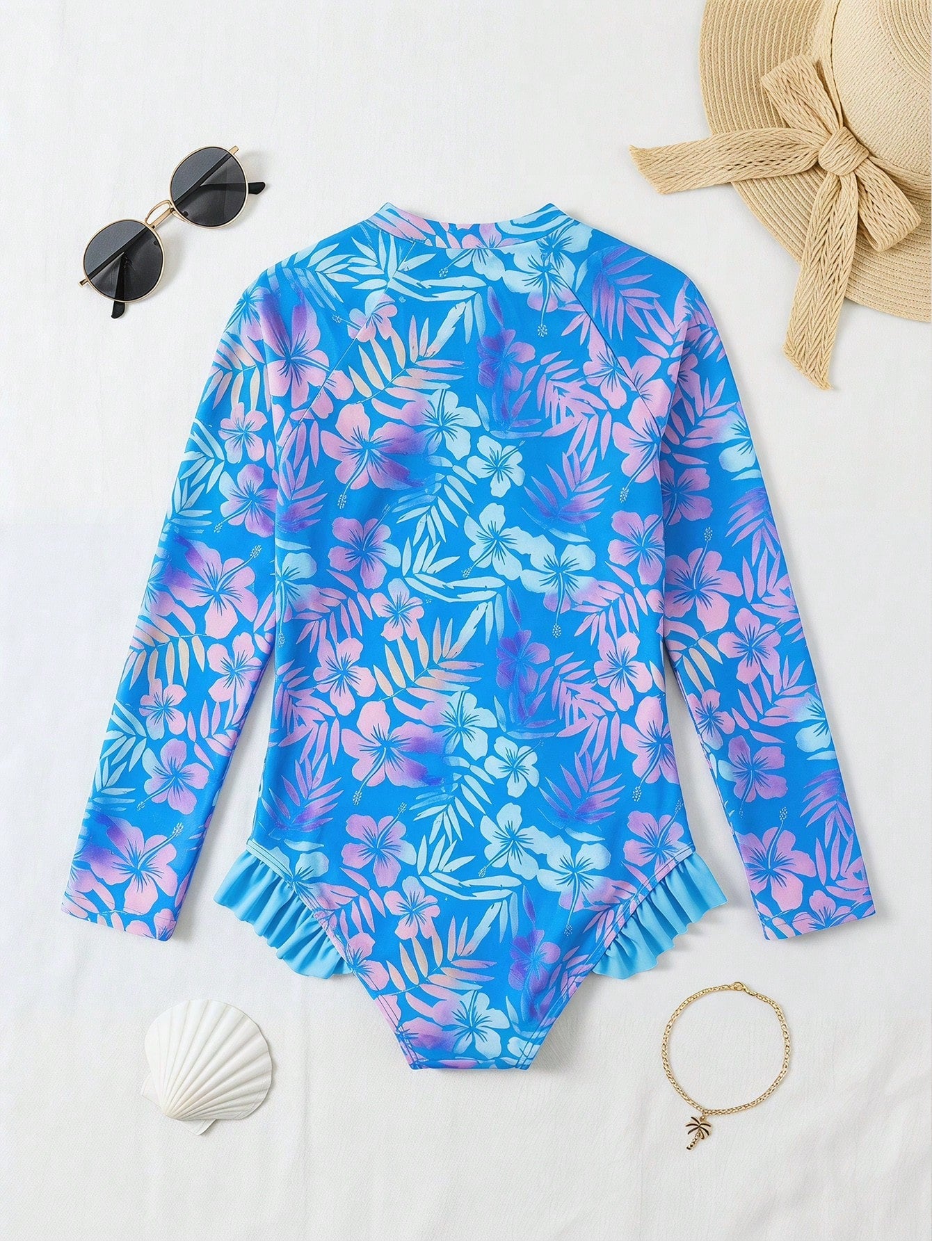 Girls' floral one-piece swimsuit with ruffle trim, high neck, and zipper front for beach and resort wear